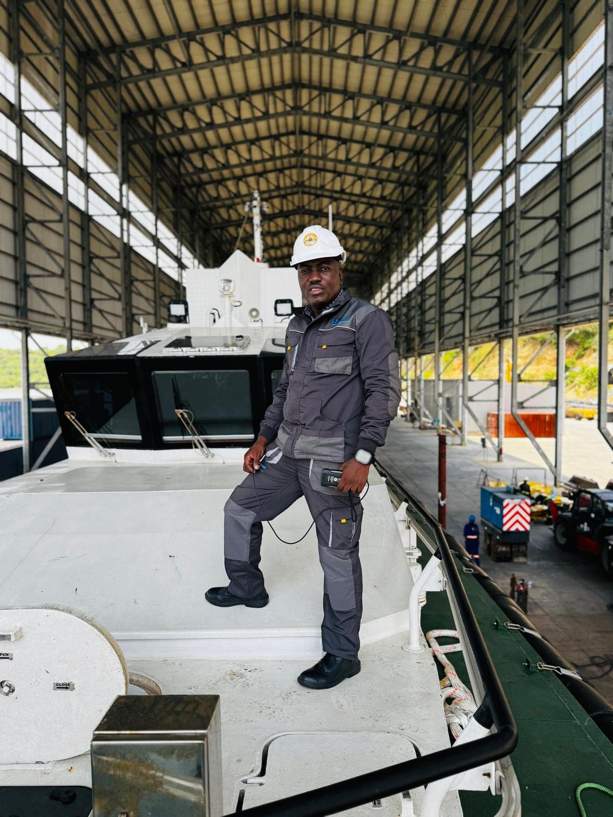 Clinton Ochieng on site aboard a vessel during a coating inspection
